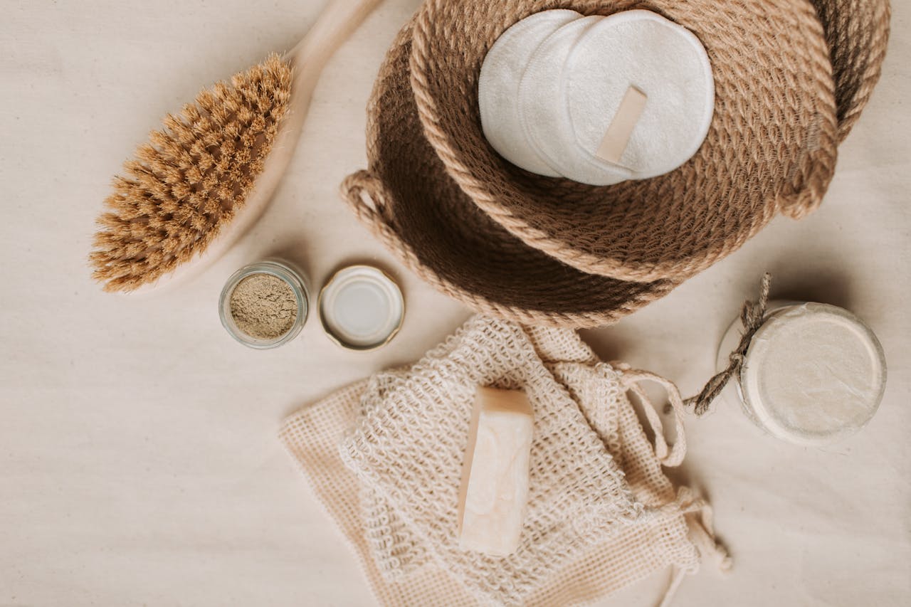 services-01 Flat lay of natural bath essentials including a dry brush and handmade soaps in an eco-friendly setup.